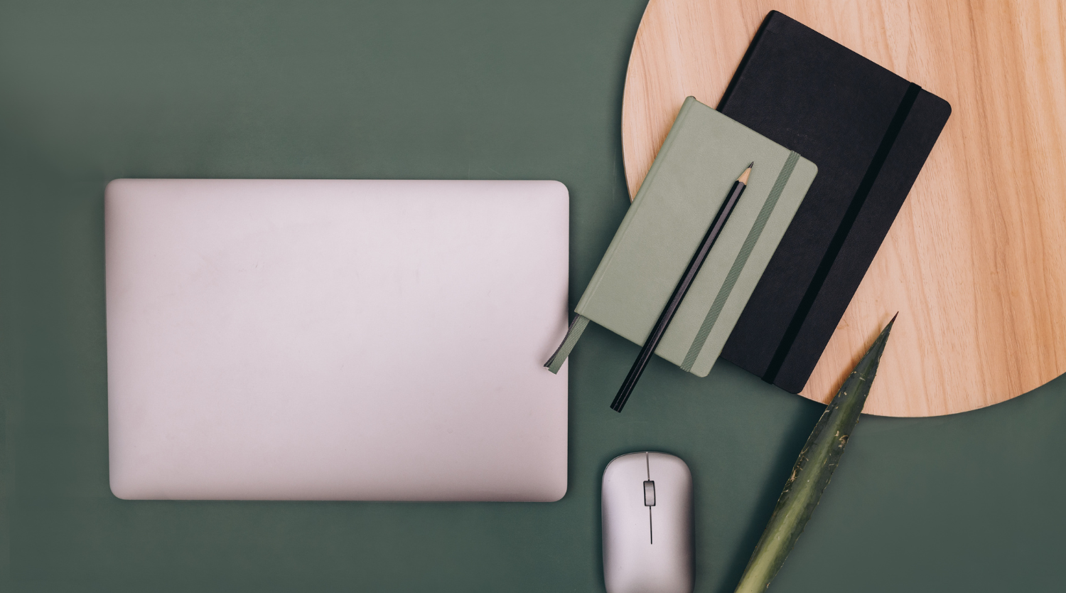 Modern workspace with laptop and green surface